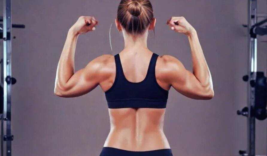 a woman flexing her muscles